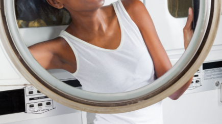 WOMAN WASHING AND DRYING HER UNDERWEAR