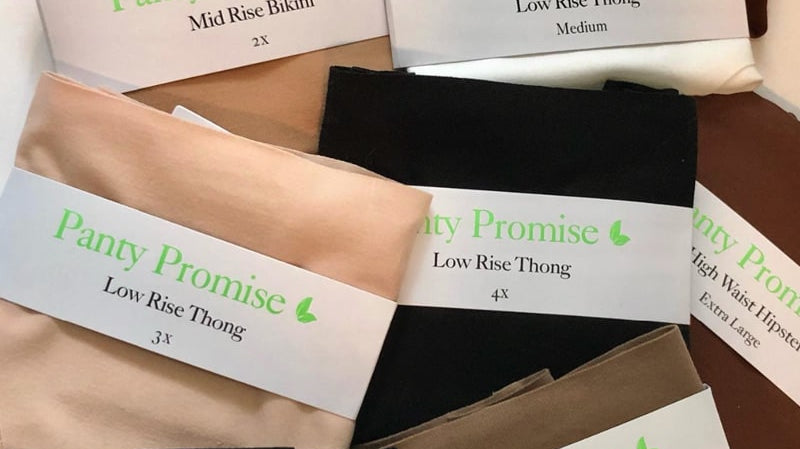 College student folding organic cotton underwear in a dorm room for healthy living