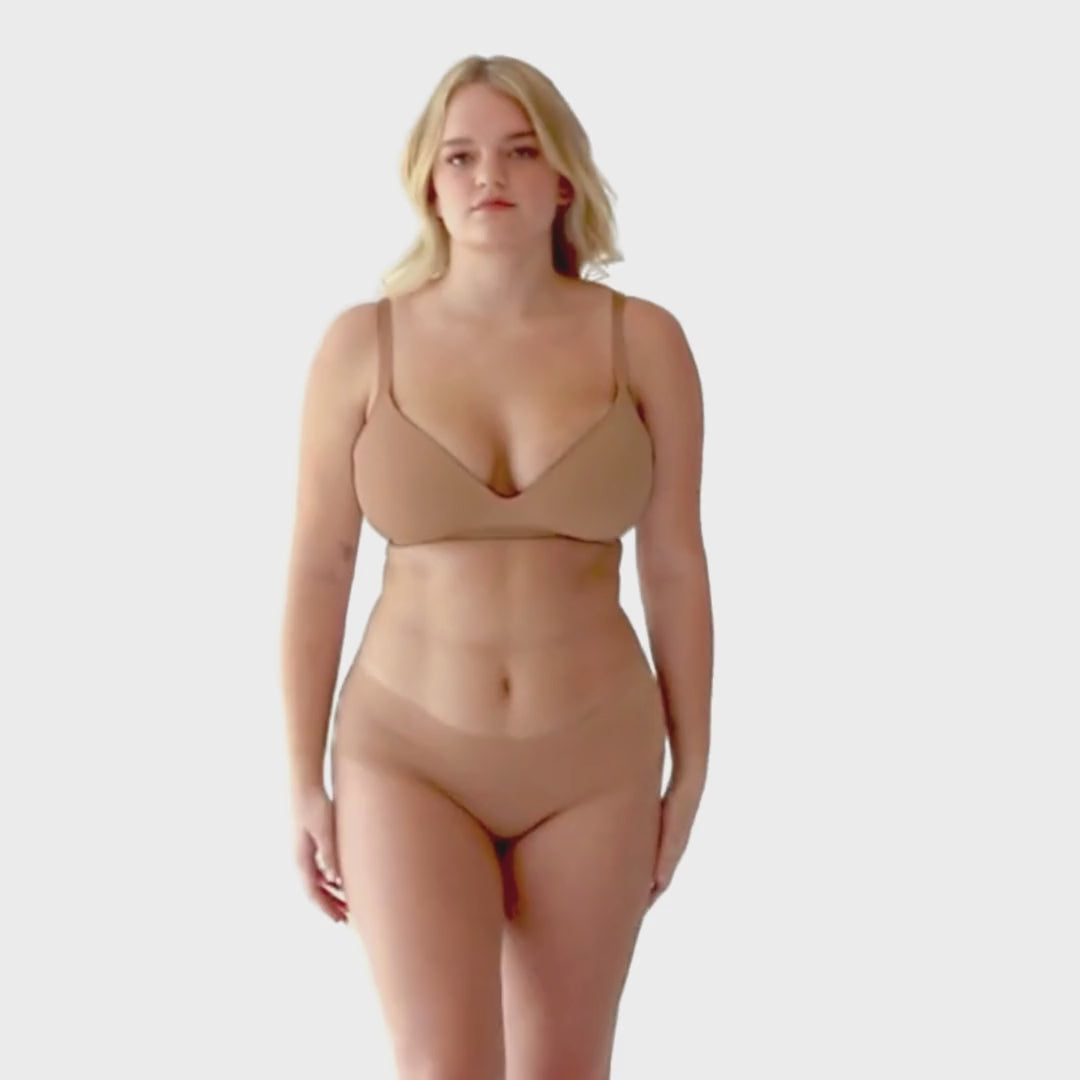 Women in video showing  Organic Cotton Low Rise Hipster underwear in color Sand