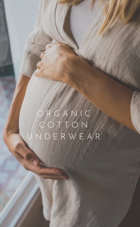 Pregnant mother holding the regnant belly promoting organic cotton underwear