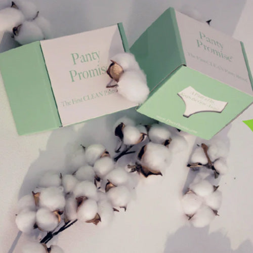Green Color Panty promise subscription boxes next to cotton bulbs