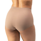 Tan underwear worn by a person on a white background