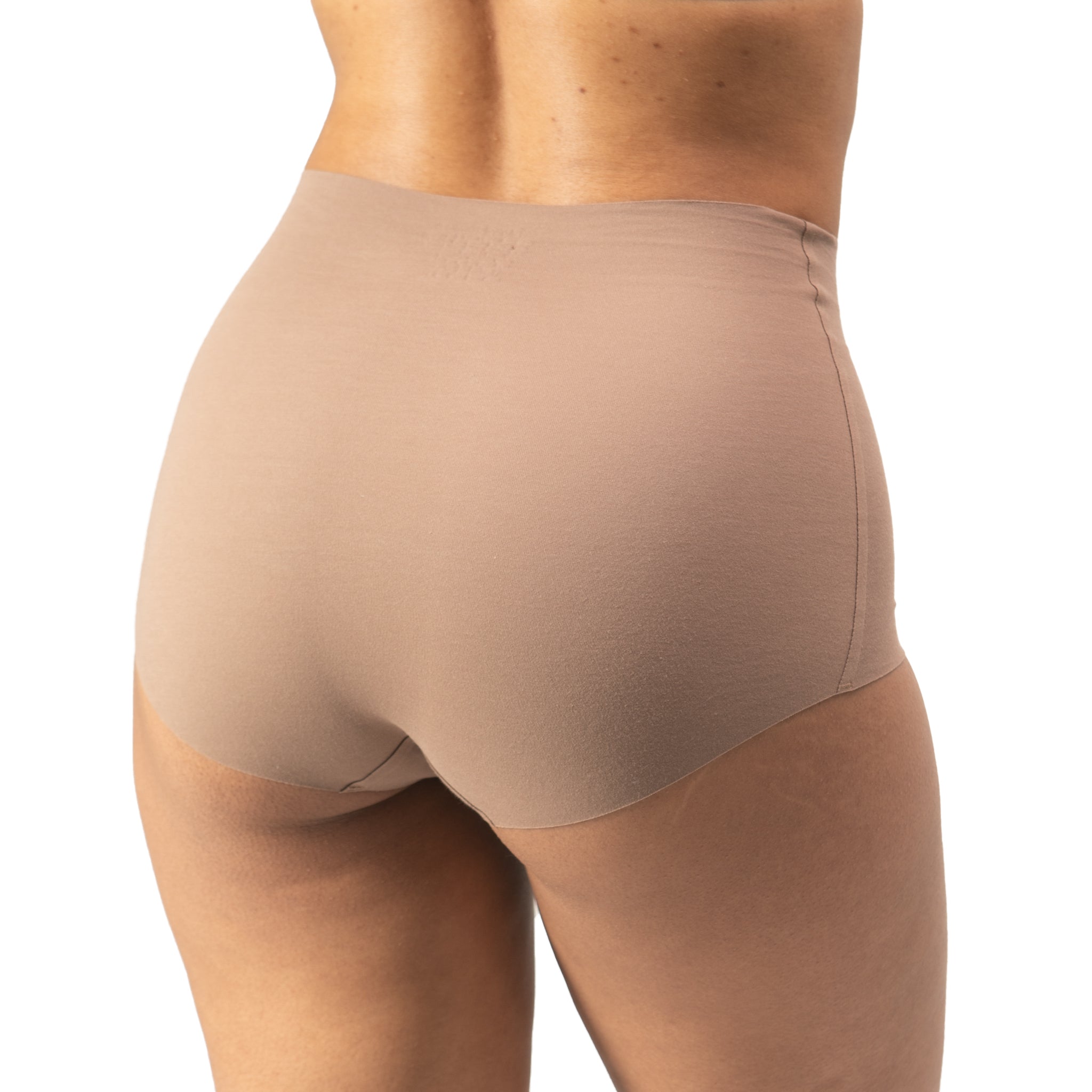 Tan underwear worn by a person on a white background